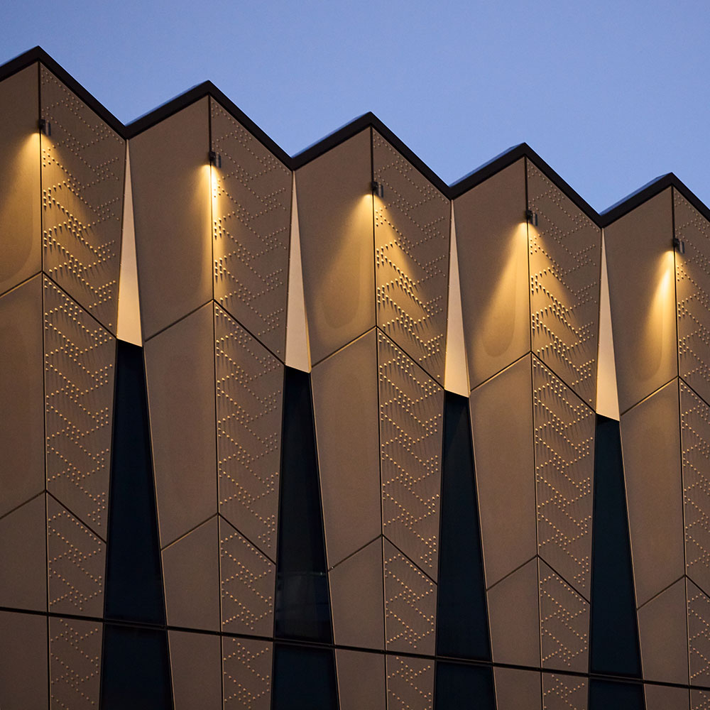  Te Manawataki o Te Papa building exterior with illuminated patterned facade.